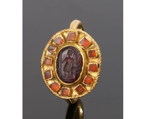 Roman 3rd Century AD gold and carnelian ring, the head with a seal carnelian of a classical figure standing with a spear and 