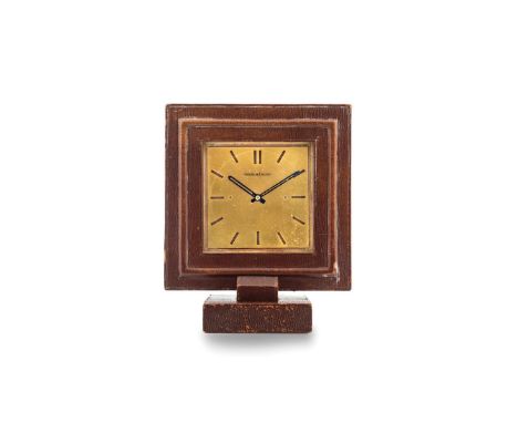 Jaeger-LeCoultre table clock, 1940s Square wooden case with leather upholstery. Champagne dial, hollowed hour markers. Hand-w