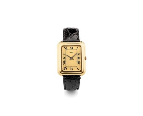 Piaget 14101 caliber Beta 21, 1970s Rectangular stepped case in 18k gold. Champagne dial, painted Roman numerals. Quartz move