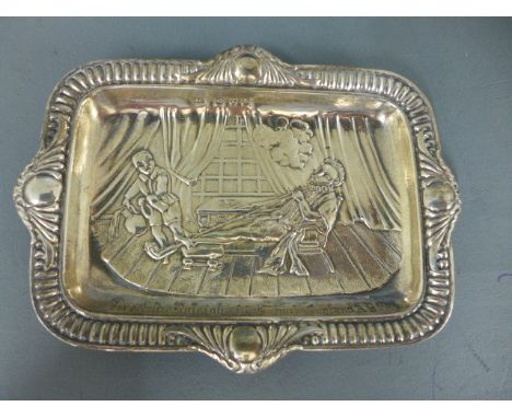 A silver embossed pin dish engraved - Sir Walter Raleigh's First Pipe in  England A.D. 1589 - hallmarked Birmingham 1897/98 -