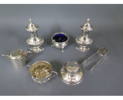 An assorted lot of nine hallmarked silver items including two peppers, salt, mustard etc - gross weight with liners approx 9 