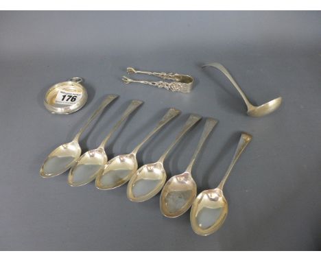 Six silver teaspoons, a silver ladle, a pair of silver nips and a silver watch case - Total weight approx. 6 troy oz
