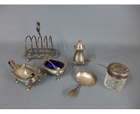 A silver cruet, silver toast rack, silver caddy spoon, knife and silver topped bottle - weighable silver approx 9 troy oz