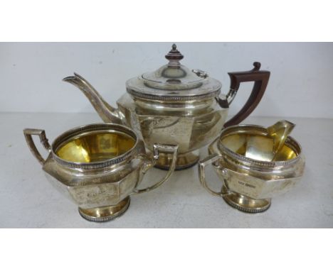 A silver hallmarked three piece tea service consisting of teapot, milk jug and sugar bowl marked for Mappin & Webb Sheffield 