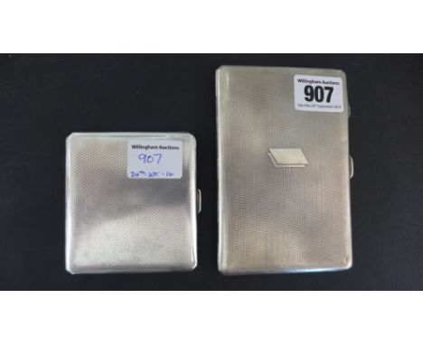 A large and a small silver cigarette case both with engine turned finish - the larger case hallmarked Birmingham 1934/35, the