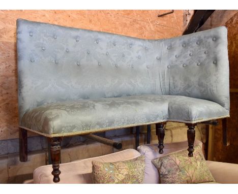 A Victorian button upholstered high back corner sofa raised on mahogany legs, 146 cm wide x 79 cm, seat depth 44 cm