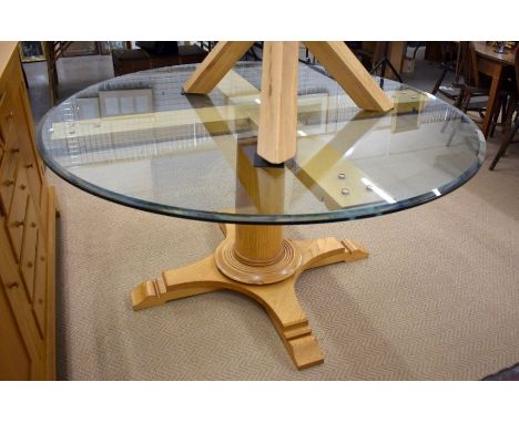 Mark Wilkinson, a contemporary glass-topped pine cross framed dining table, 150 cm dia. x 75 cm h