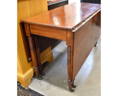 A Victorian Sheraton design mahogany part dining table (centre section), with drop leaves over twin ring turned gate-legs to 