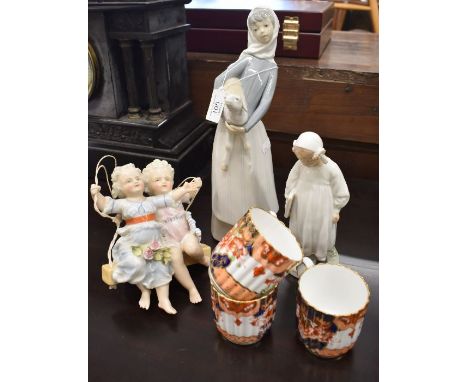 Dresden porcelain group, children on a swing (lacks frame) to/w Royal Copenhagen girl with picture-book, Lladro girl with lam