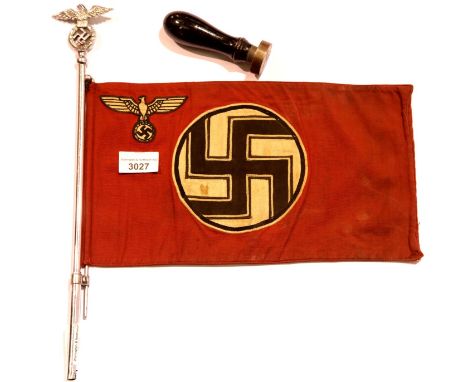 German WWII type car pennant on a chromed eagle and swastika pole and two Nazi wooden handled metal stamps, liberated from th