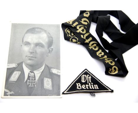 German Third Reich type photographic postcard of Major Ihlefeld, together with a Kriegsmarine hat ribbon and cloth OFT Berlin