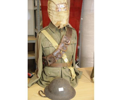 British WWI type Tommy representation set, comprising tunic and equipment includinggas hood and brodie steel helmet. P&amp;P 