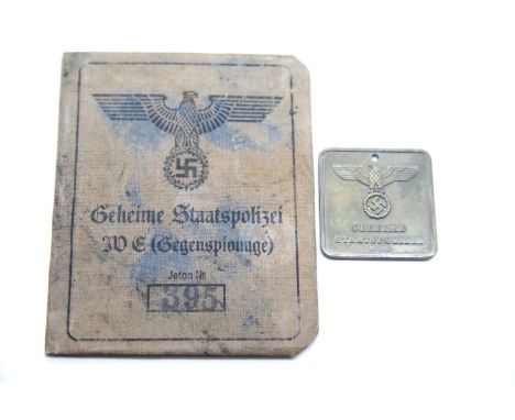 German SS type Gestapo brass tag and canvas covered identity book. P&amp;P Group 1 (£14+VAT for the first lot and £1+VAT for 