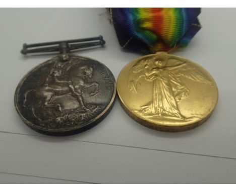 British WWI medal pair to 32231 Cpl J E Milne THE QUEEN'S R, wounded 1918 with original and facsimile documentation, his serv