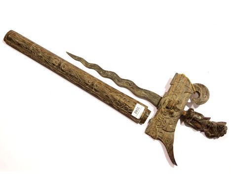 Middle Eastern kriss, blade L: 30 cm, having a heavily carved grip and scabbard. P&amp;P Group 2 (£18+VAT for the first lot a