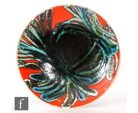A Poole Pottery shape 3 Delphis shallow footed dish decorated by Jean Millership with a tonal green abstract pattern over a r