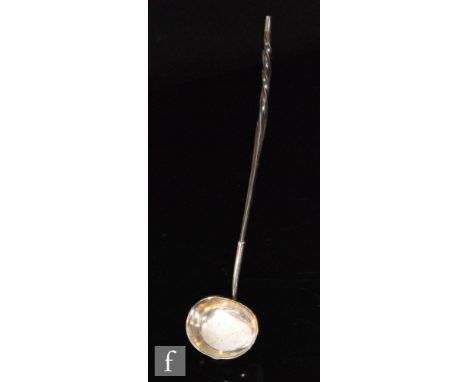 A Scottish hallmarked silver toddy ladle, plain oval bowl below twisted whale bone handle, length 34cm, with Edinburgh and Pe