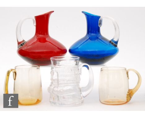 A collection of Whitefriars glass, to include an M165 Jeremy Toby jug in flint, height 13.5cm, two jugs of compressed form wi