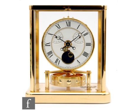 A Jaeger-Le-Coultre Atmos clock in brass framed glazed case, circular white enamelled dial incorporating Oc and % HR subsidia