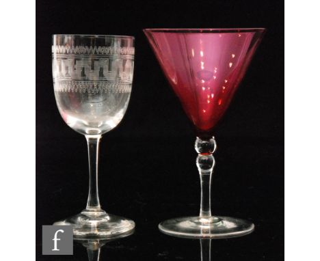 A 1920s cocktail glass with conical ruby bowl with clear knopped stem and spread foot, height 12.5cm, together with a late 19