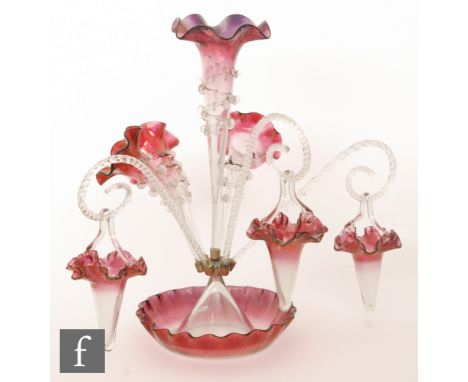 A late 19th Century Stourbridge glass epergne having a deep frill rim bowl with a tall central trumpet surrounded by three lo