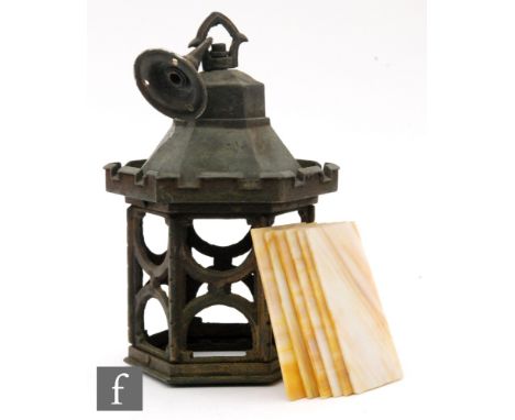 A 1930s cast iron castellated hall lantern with separate yellow panel sides, height 33cm 