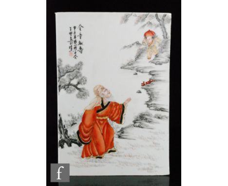 A Chinese porcelain plaque of rectangular form, painted in monochrome enamels and picked out in vibrant iron red, depicting a