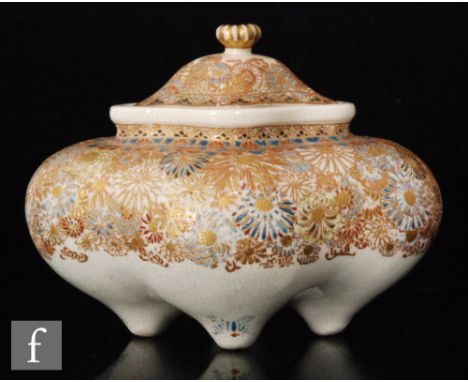 A Japanese Satsuma censer, the quatrefoil lobed shaped vessel raised on tripod supports with fitted domed cover, with all ove