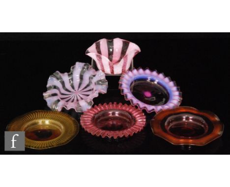 A collection of six 19th Century finger bowls in shades of ruby, pink and amber, four with threaded decoration and two with o