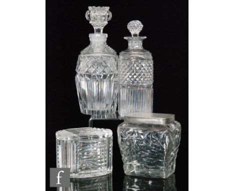 A Georgian flat cut glass tea caddy of square form with white metal lid, two decanters with cut decoration and an oval box wi