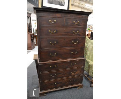 A George III mahogany chest on chest, fitted with an arrangement of two short over six long cock-beaded drawers, with a denti
