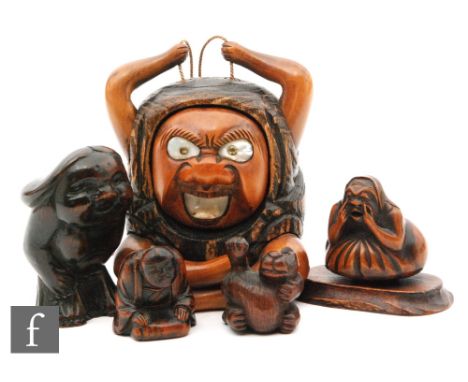 A collection of Japanese carved wooden netsuke and carvings, Meiji/Taisho period, to include a monkey, a phallus in the form 