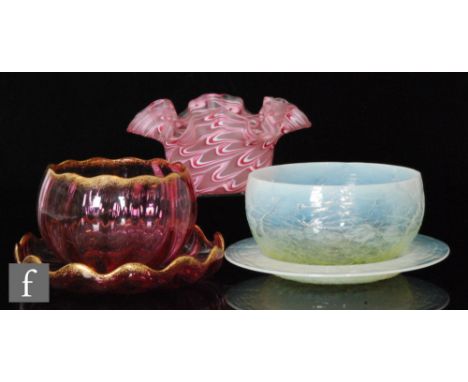 A group of 19th Century finger bowls to comprise an example with graduated straw iridescence and cut with veining with confor