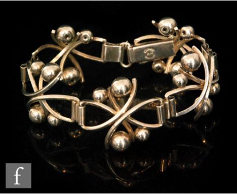 A Danish silver five panel flexible bracelet with pairs of shot ball details, terminating in tongue and box fastener, length 