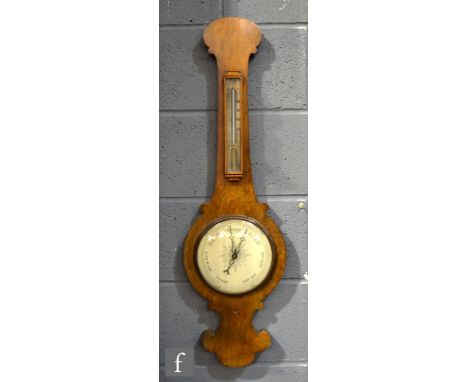 A 19th Century walnut wheel barometer incorporating a thermometer, height 92.5cm