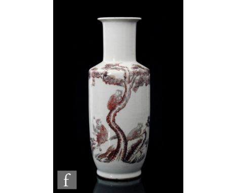 A Chinese porcelain rouleau vase, the white ground detailed in iron red with a depiction of three monkeys climbing a pine tre