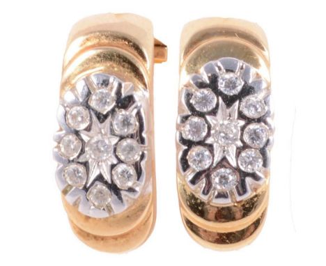 A pair of cubic zirconia earrings, each earring with nine brilliant cut stones claw and collet set in a yellow and white meta