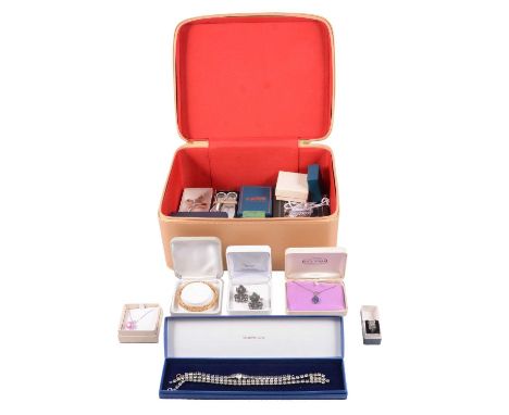 A collection of white metal and costume jewellery in a large Estée Lauder make-up case, a marcasite and white metal ring size