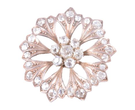 A diamond floral brooch, the centre claw set with seven old cut stones and each of the nine petals claw set with three old cu