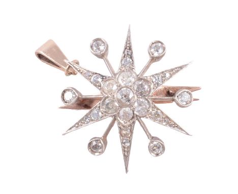 A Victorian diamond star brooch / pendant, the central old cut stone surrounded by six old cut stones with a further twelve g