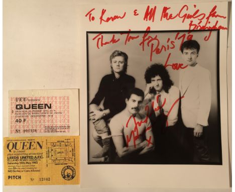 FREDDIE MERCURY SIGNED WITH TICKETS. An 8x10" Queen press photograph inscribed in red marker pen with a message and signature