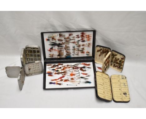 A selection of 5 fly fishing boxes and contents of both trout and salmon flies the two vintage black boxes are possibly Hardy