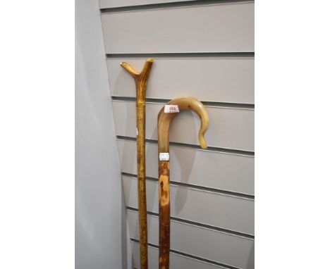 A shepherds crook and thumb stick measuring 120cm and 124cm respectively