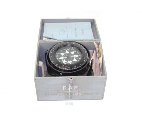 A boxed compass on a gimbal with WWII era R.A.F. photograph, letter and note book