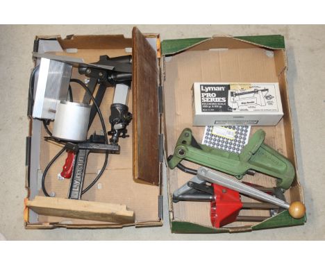 Two boxes of various re-loading items including scales, press, melting pot etc.