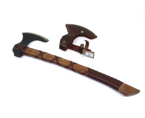 A replica of a fighting axe with leather sheath