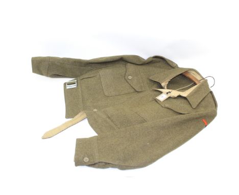 A Battle dress blouse, size 9, dated Jan 4 1943 with insignia for a Major. Not named but from the same family as the previous