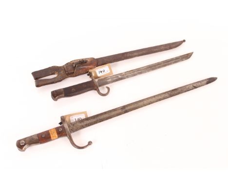 A Turkish model 1903 bayonet (no scabbard) with an AF Japanese model 1897 bayonet, scabbard and frog