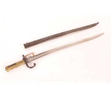 A French model 1866 brass hilted sabre bayonet with scabbard (matching numbers) and dated 1873