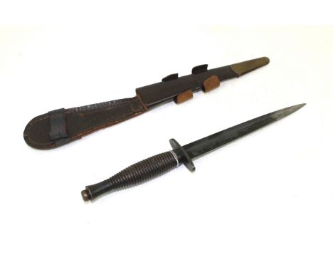 A  3rd patt F&S fighting knife with leather sheath. Hilt marked R. Cooper Sheffield England